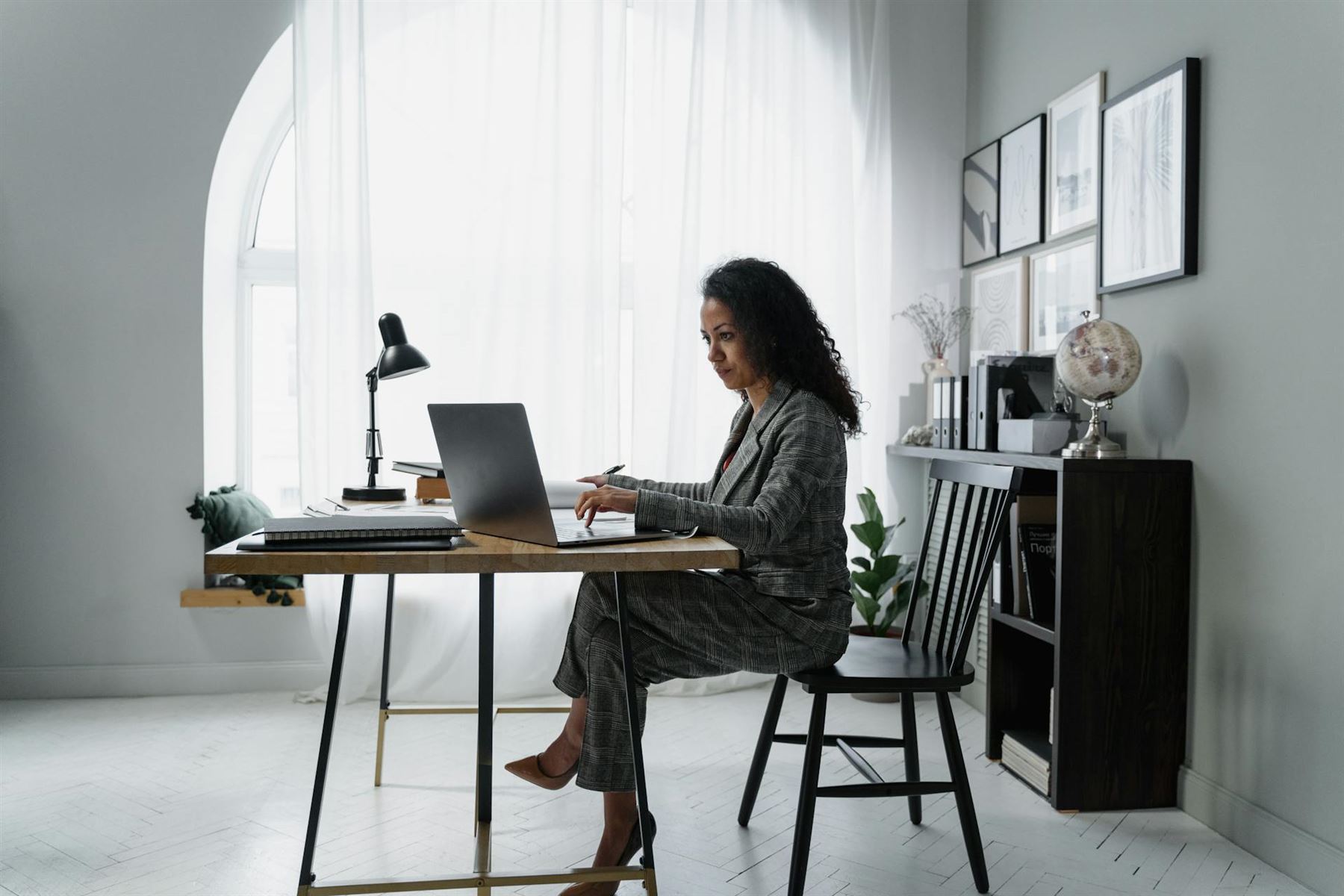Suited lady at desk working