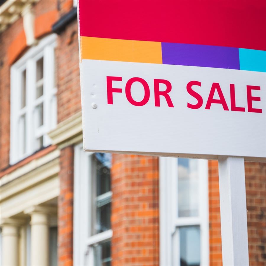 House with for sale sign