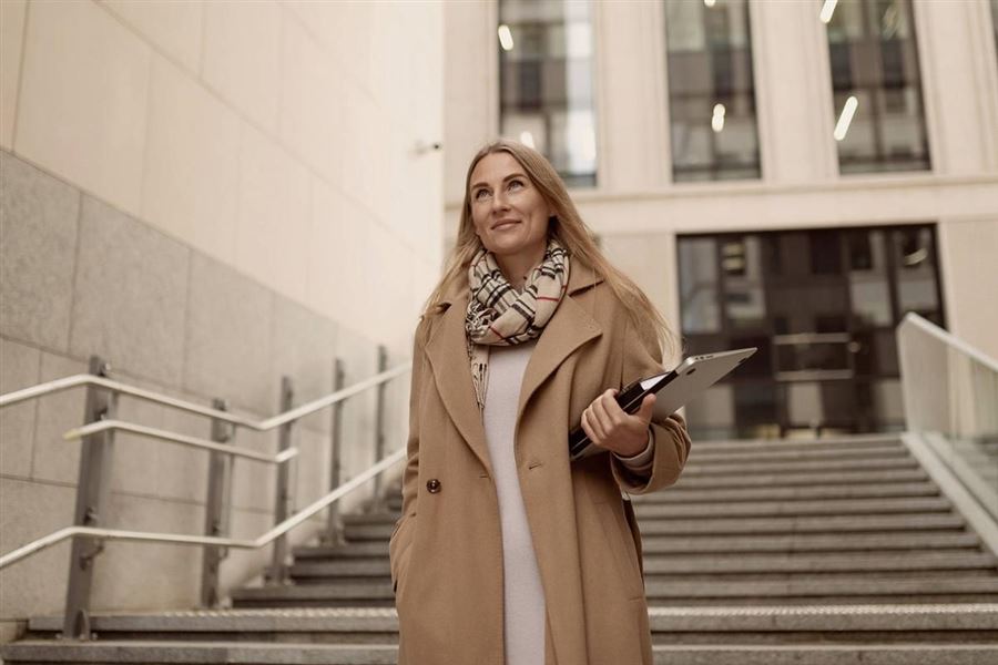 Business woman walking down stairs