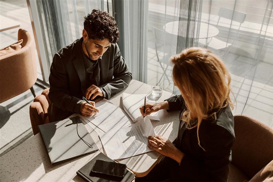 Colleagues discussing files