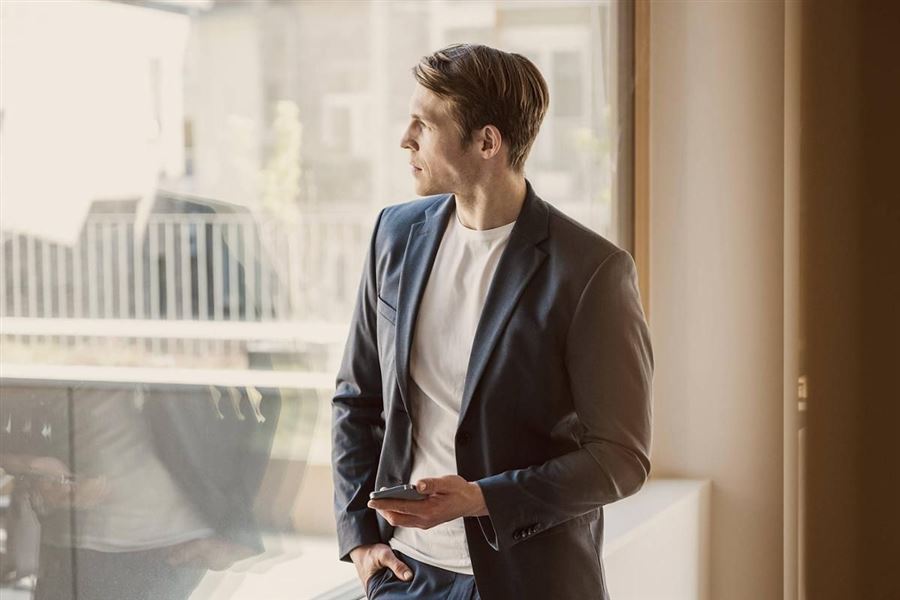 Businessman looking out a window