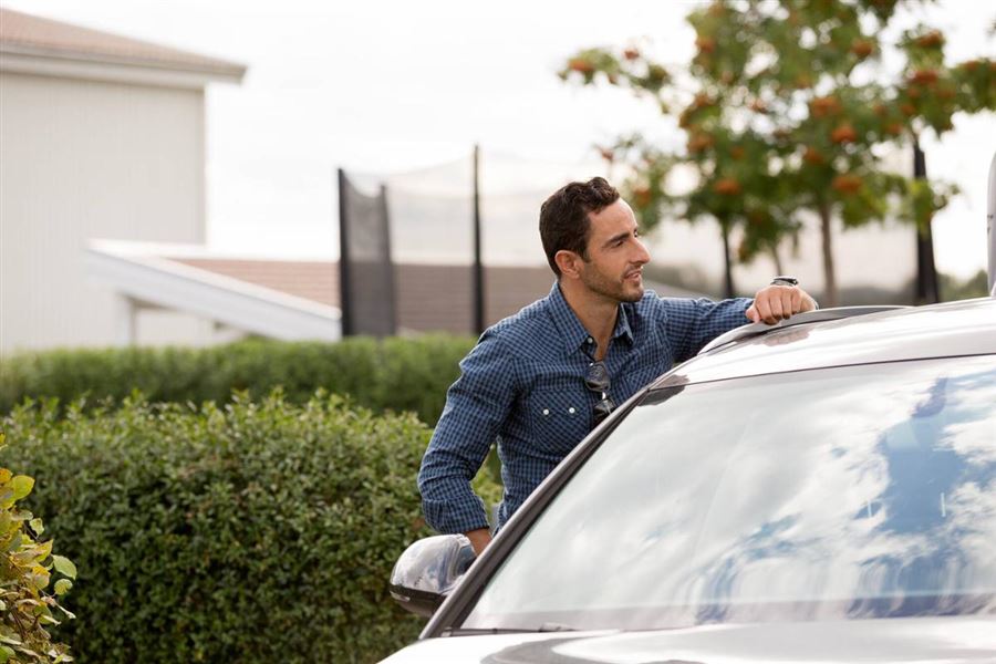 Man standing by car