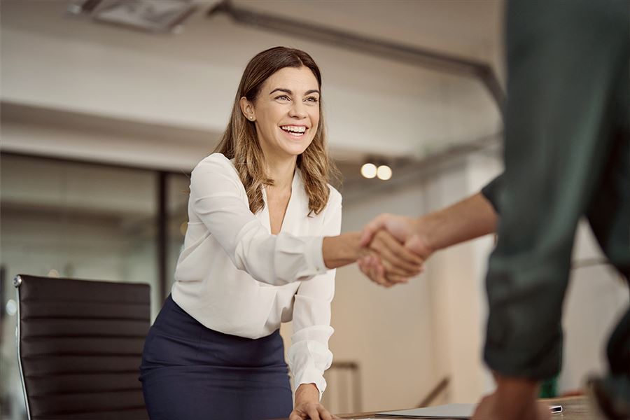 Smiling woman holding hands